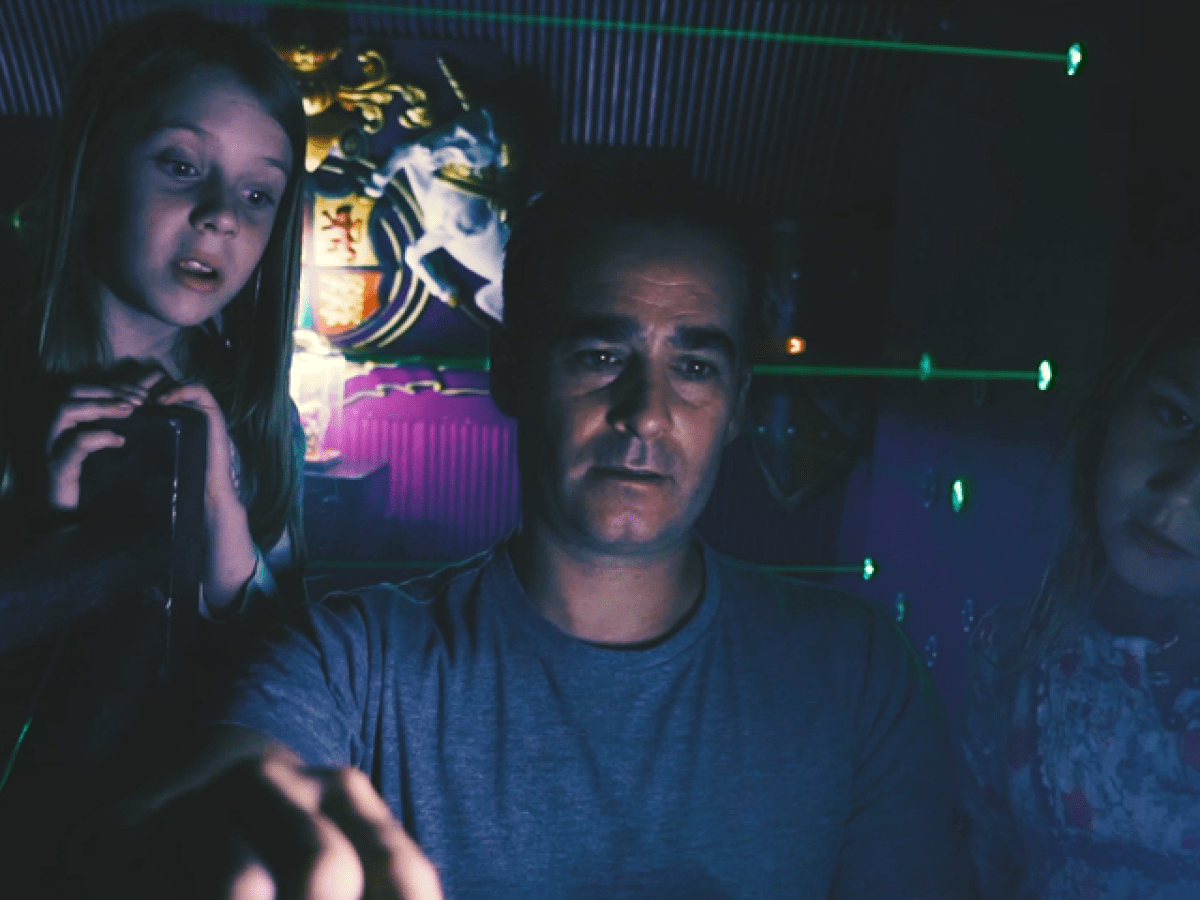 a man taking a selfie in a dark room